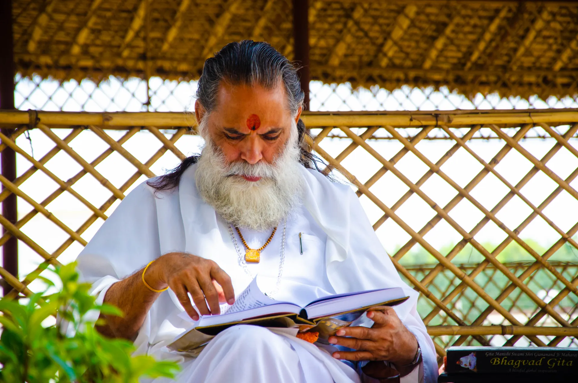 Maharaj Ji reading the Bhagwad Gita